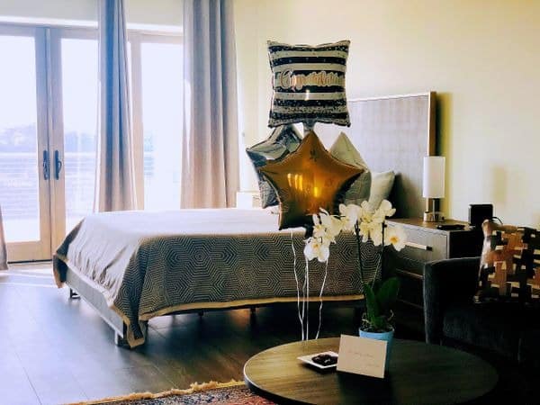 Stylish bedroom interior with modern decor and star balloon.